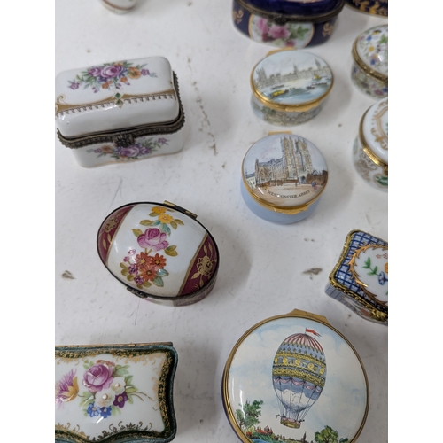 6 - A collection of enamel and porcelain trinket boxes to include Halcyon Days examples, a Limoges trink... 