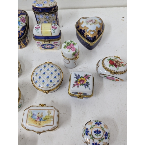 6 - A collection of enamel and porcelain trinket boxes to include Halcyon Days examples, a Limoges trink... 