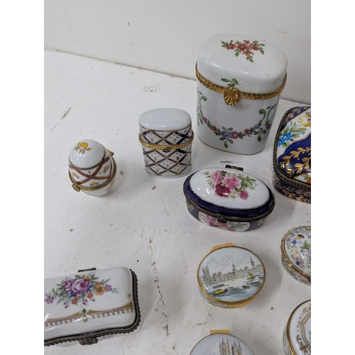 6 - A collection of enamel and porcelain trinket boxes to include Halcyon Days examples, a Limoges trink... 