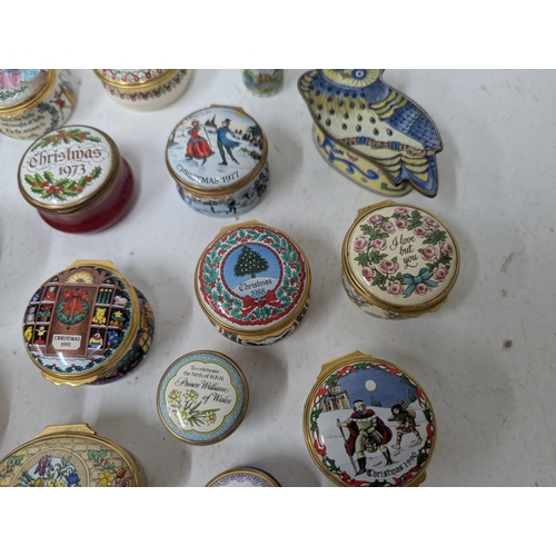 60 - A collection of enamelled trinket boxes, mainly by Halcyon Days, examples to include Bilston and Bat... 