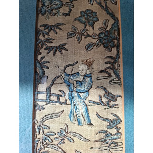 46 - Three late 19th/early 20th Century Chinese embroidered silk panels, two housed in one frame, all dep... 
