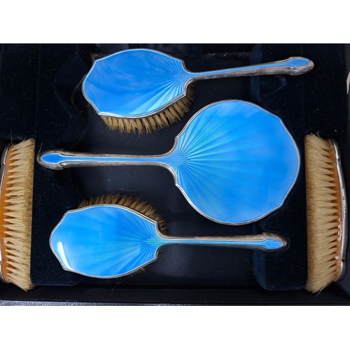 45 - A Walker and Hall silver and blue guilloche boxed set of 4 dressing table brushes and a hand mirror.... 