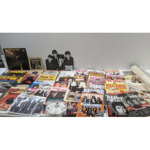 A collection of music memorabilia from the 1960s onwards to include LPs ...