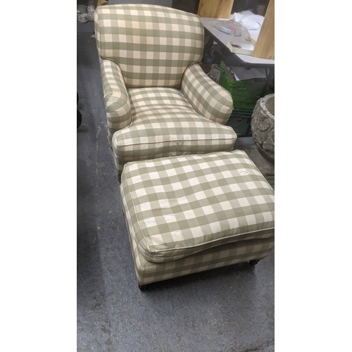 A George Smith deep armchair with a green cheque pattern on turned legs and brass casters with a matching footstool
Location:GM
If there is no condition report shown, please request