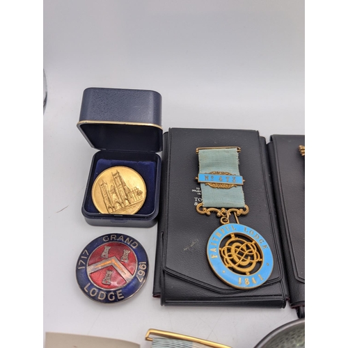 10 - Masonic regalia to include a collection of silver and metal jewels comprising of a Masonic charity j... 