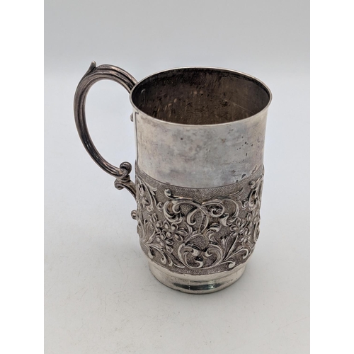 18 - A Victorian silver christening mug, hallmarked Birmingham 1900, with c-scroll handle and thumb rest,... 