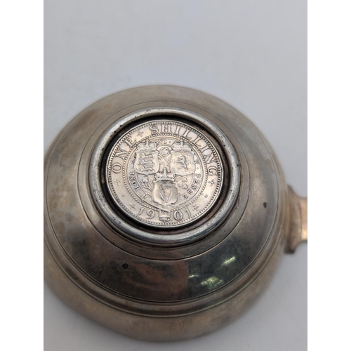 36 - A silver tea strainer hallmarked Birmingham 1942 by E J Evans and Co, along with a quaich in set wit... 