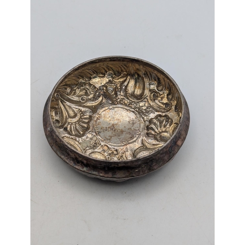 46 - A silver dressing table lid, with floral embossed decoration with central vacant cartouche, 65.6g
Lo... 