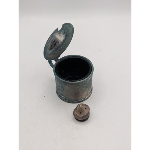 49 - A silver lidded mustard pot with a blue glass liner with a white metal top, total weight excluding g... 