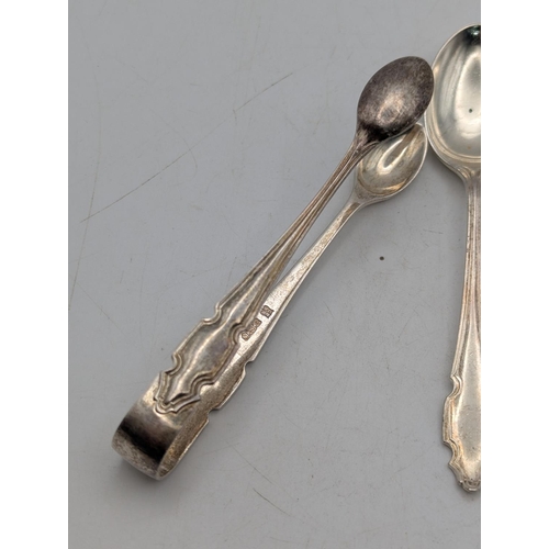 55 - A set of four teaspoons together with a pair of matching sugar tongs by Cooper Brothers and Sons Ltd... 