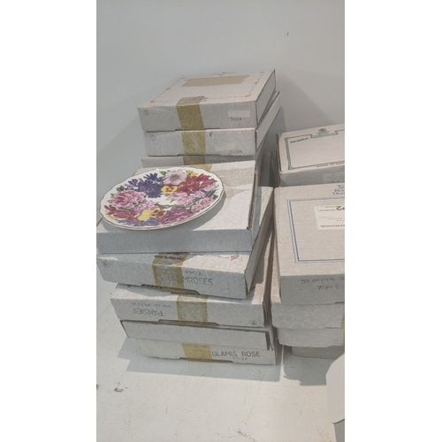 518 - A large collection of boxed collectors plates to include Royal Worcester examples, Royal Albert exam... 
