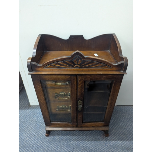 1 - A smoker's cabinet with three drawers and twin glazed doors 48 x 33cm Location: A3M
If there is no c... 