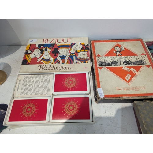 11 - A mixed group of collectables to include Egyptian tourist items, vintage board and card games and ot... 