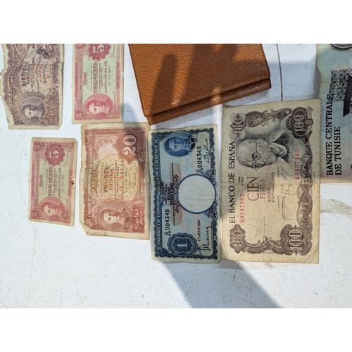12 - World coinage and banknotes to include France, Britain and others, Malaya 5-cents banknotes and othe... 
