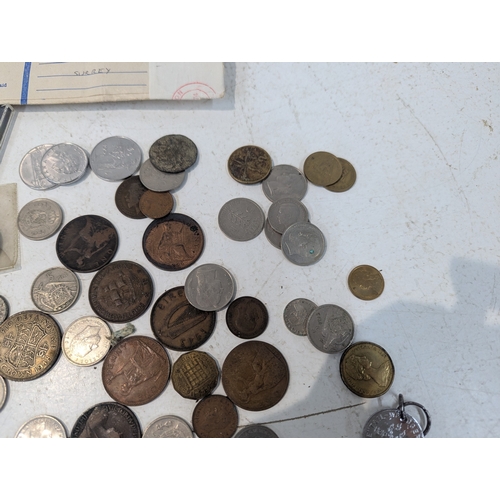 12 - World coinage and banknotes to include France, Britain and others, Malaya 5-cents banknotes and othe... 