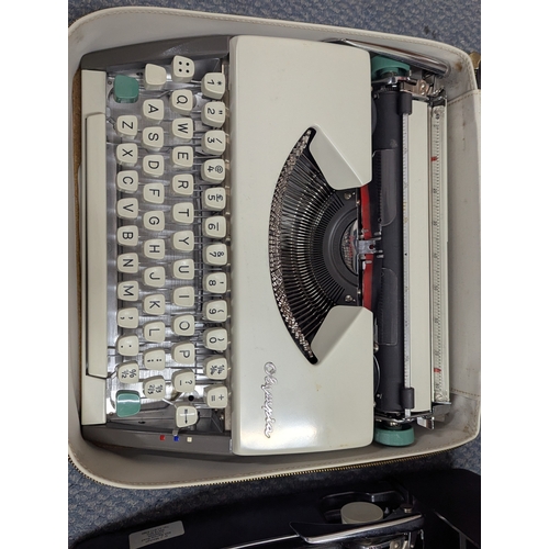 14 - A mixed lot to include two Bakelite telephones, Olympia typewriters, a pair of binoculars and other ... 