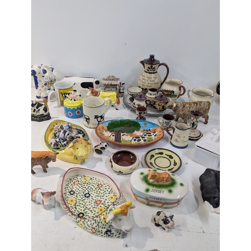 15 - A mixed lot of ceramics to include an assortment of bovine related ceramics to include a Beswick tog... 