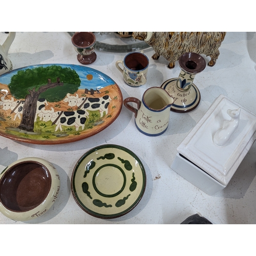 15 - A mixed lot of ceramics to include an assortment of bovine related ceramics to include a Beswick tog... 