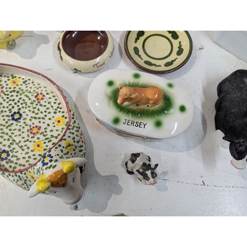 15 - A mixed lot of ceramics to include an assortment of bovine related ceramics to include a Beswick tog... 