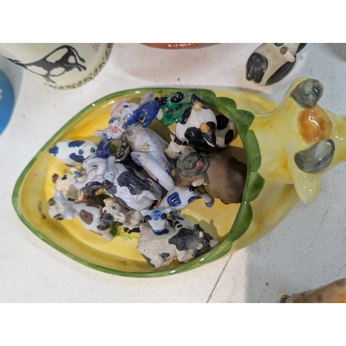 15 - A mixed lot of ceramics to include an assortment of bovine related ceramics to include a Beswick tog... 