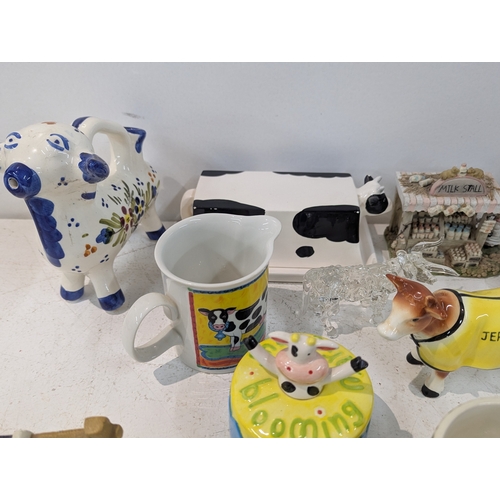 15 - A mixed lot of ceramics to include an assortment of bovine related ceramics to include a Beswick tog... 