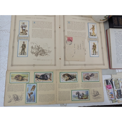 30 - A mixed lot to include stamps, cigarette cards, Capstan dominoes and other items Location: G4
If the... 