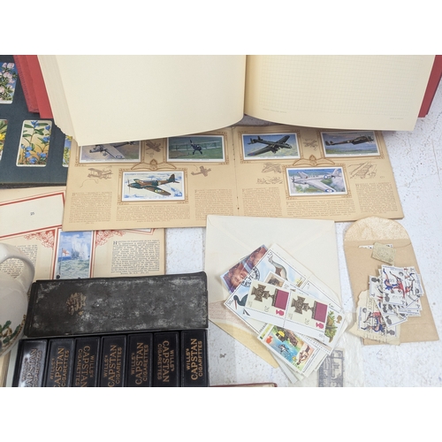30 - A mixed lot to include stamps, cigarette cards, Capstan dominoes and other items Location: G4
If the... 