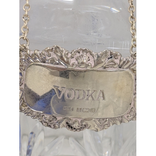 37 - A collection of glassware along with four crystal decanters all with decanter labels, one silver hal... 