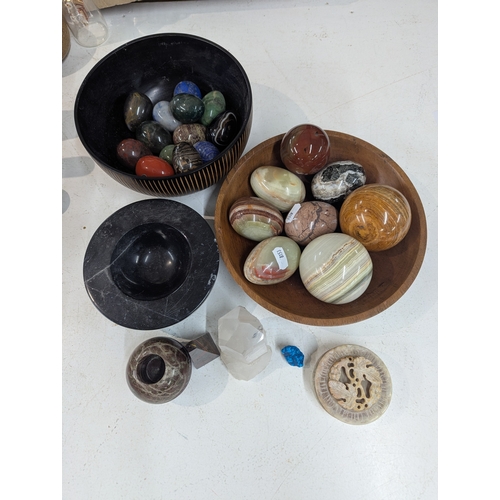 4 - A collection of polished stone eggs to include green onyx and marble and other related items, along ... 