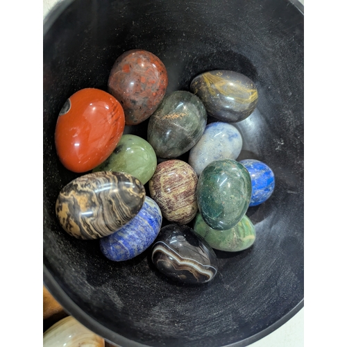 4 - A collection of polished stone eggs to include green onyx and marble and other related items, along ... 