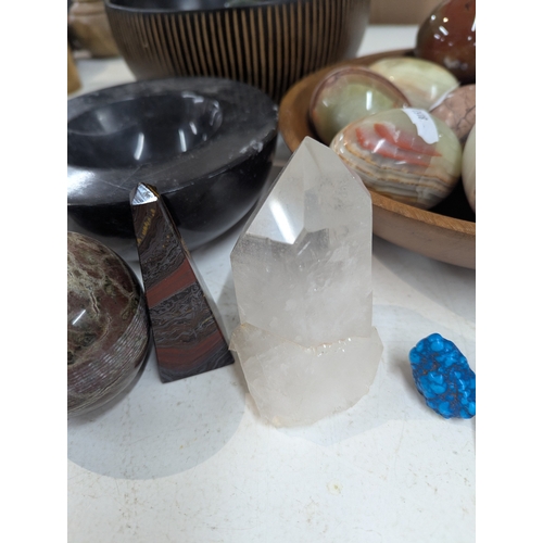 4 - A collection of polished stone eggs to include green onyx and marble and other related items, along ... 