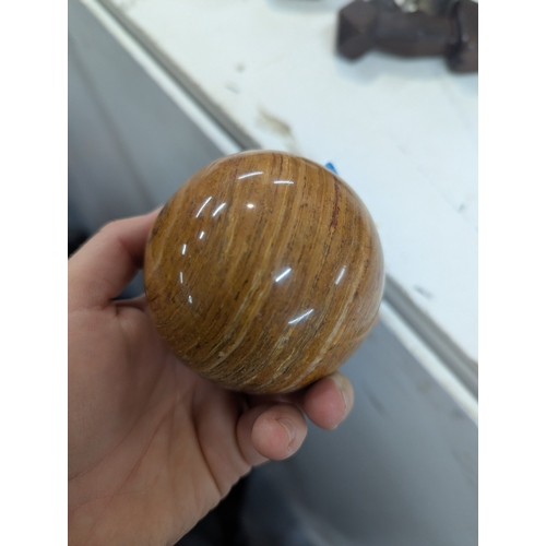 4 - A collection of polished stone eggs to include green onyx and marble and other related items, along ... 