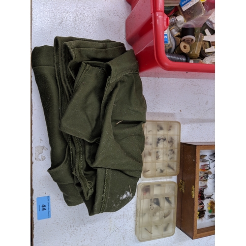 44 - A collection of fly fishing equipment and accessories to include a rod, a selection of flies, spare ... 