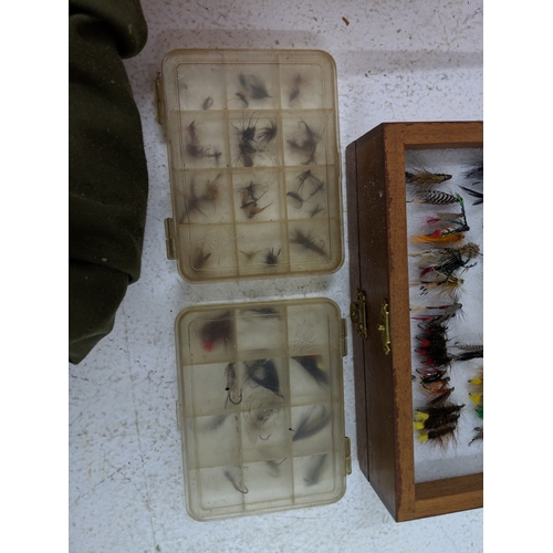 44 - A collection of fly fishing equipment and accessories to include a rod, a selection of flies, spare ... 