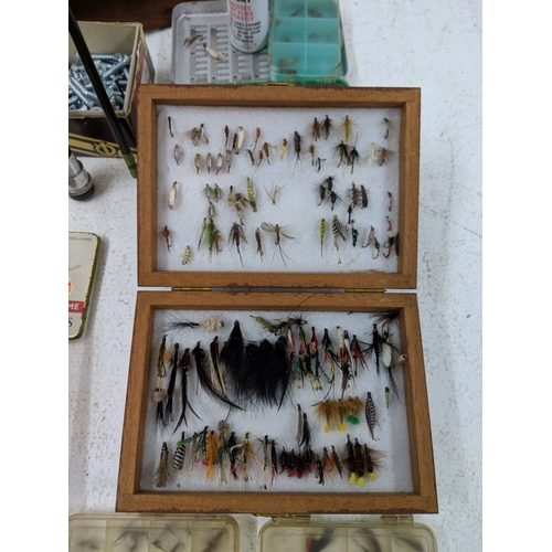 44 - A collection of fly fishing equipment and accessories to include a rod, a selection of flies, spare ... 