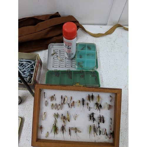 44 - A collection of fly fishing equipment and accessories to include a rod, a selection of flies, spare ... 
