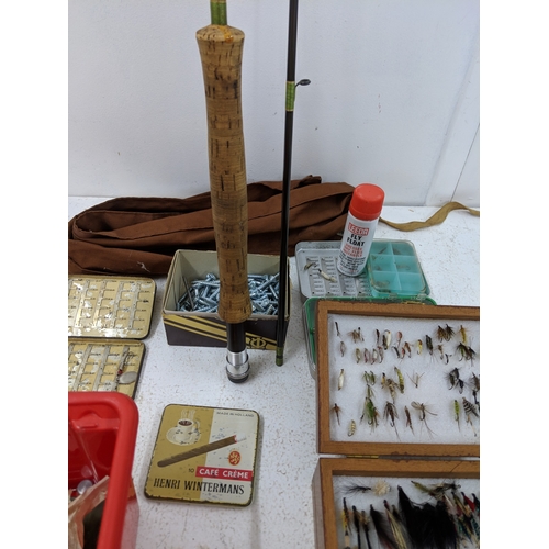 44 - A collection of fly fishing equipment and accessories to include a rod, a selection of flies, spare ... 