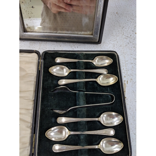 45 - Silver plated items to include a cased set of coffee spoons, along with sugar tongs, a coffee pot, t... 