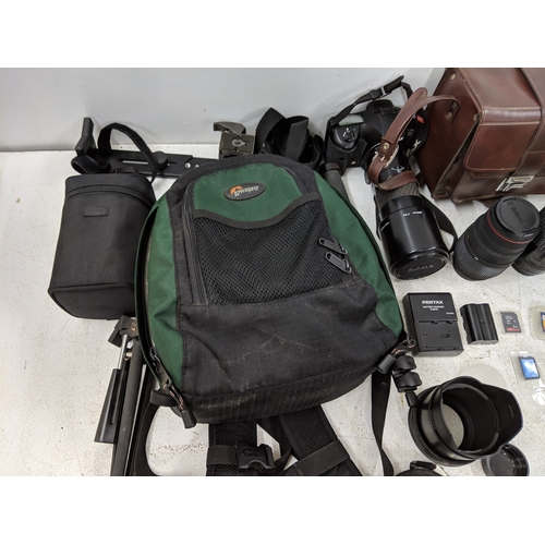52 - Photographic equipment to include a Pentax 300mm lens, a Pentax K20 camera, a Sigma Telephoto 400mm ... 