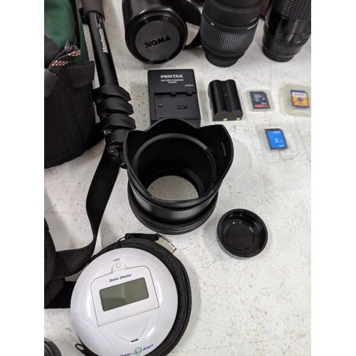 52 - Photographic equipment to include a Pentax 300mm lens, a Pentax K20 camera, a Sigma Telephoto 400mm ... 