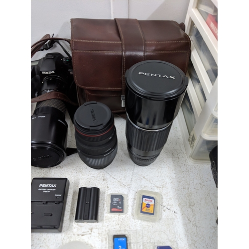 52 - Photographic equipment to include a Pentax 300mm lens, a Pentax K20 camera, a Sigma Telephoto 400mm ... 