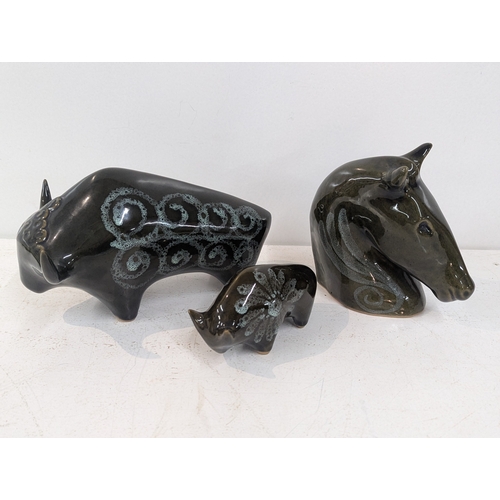 7 - Three Lotus Pottery ceramic figures to include two bulls Location: 11-3
If there is no condition rep... 