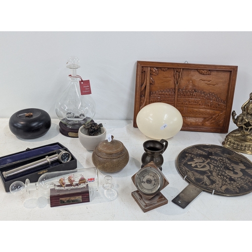 8 - A mixed group of collectables to include a Japanese hand mirror, an aneroid barometer, ostrich egg a... 
