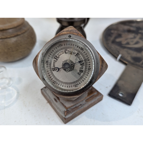 8 - A mixed group of collectables to include a Japanese hand mirror, an aneroid barometer, ostrich egg a... 