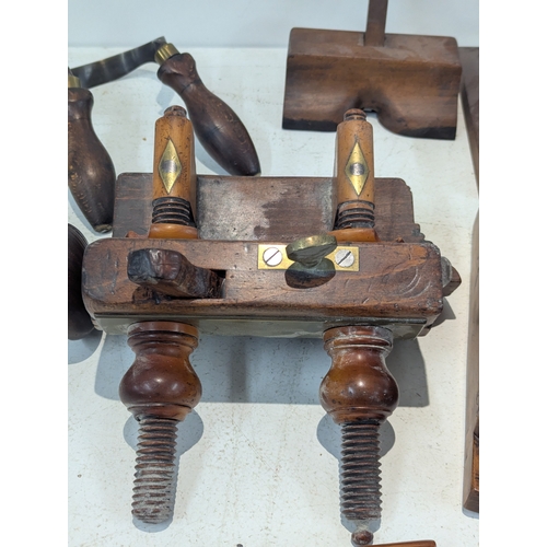 9 - A collection of traditional wooden woodworking tools including several planes, Granny's tooth router... 