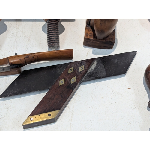 9 - A collection of traditional wooden woodworking tools including several planes, Granny's tooth router... 