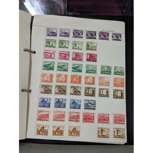 41 - Stamps from around the world to include Australia, Hungary, Jamaica and others, housed in three albu... 