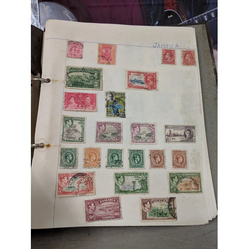 41 - Stamps from around the world to include Australia, Hungary, Jamaica and others, housed in three albu... 
