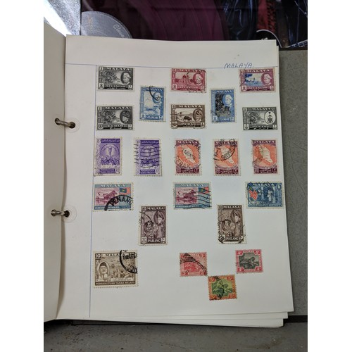 41 - Stamps from around the world to include Australia, Hungary, Jamaica and others, housed in three albu... 