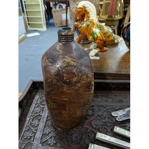 48 - A mixed lot to include silver plated cutlery, a Doulton Lambeth vase, a large carved tray, a teapot ... 